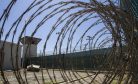 Should a Man Face Trial Alone at Guantanamo Bay While His 2 Co-Accused Return Home?
